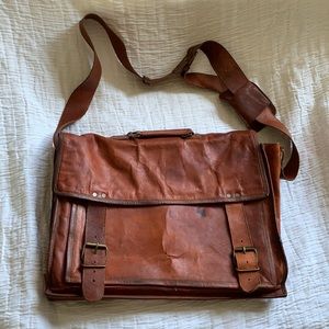 Komal’s leather briefcase